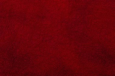 Koyu kırmızı deri yüzeyi arka plan, deri doku olarak. 