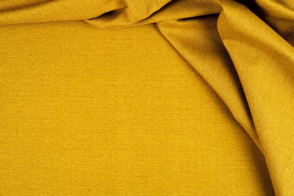 Yellow fabric background texture. Yellow cloth.