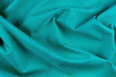 Katlı parlak mavi kumaş dokusu. 