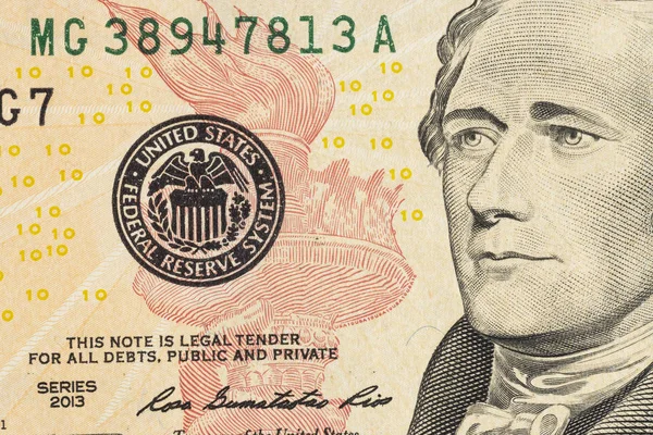 Alexander Hamilton face on US ten or 10 dollars bill macro,