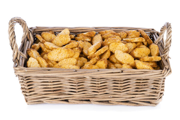 Wicker basket with salty crackers. 