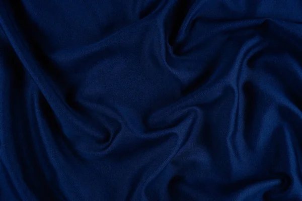 Φωτεινή μπλε υφασμάτινη υφή με πτυχώσεις. — Φωτογραφία Αρχείου