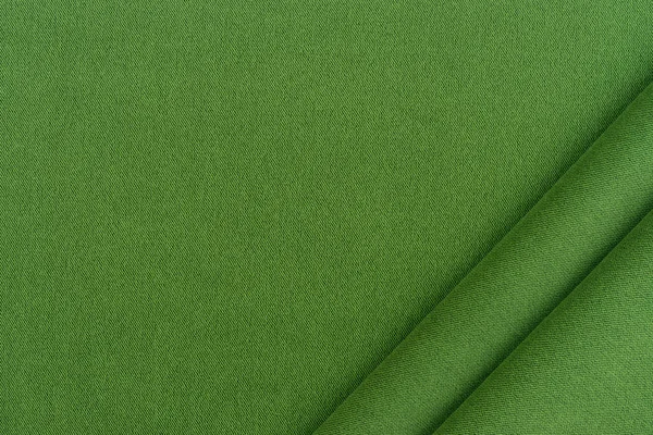 Zöld szövet háttér textúra. — Stock Fotó