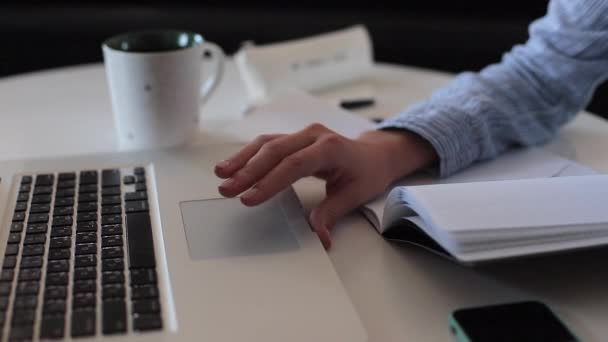 Student working and swipe on laptop. Female hand. — Stock Video