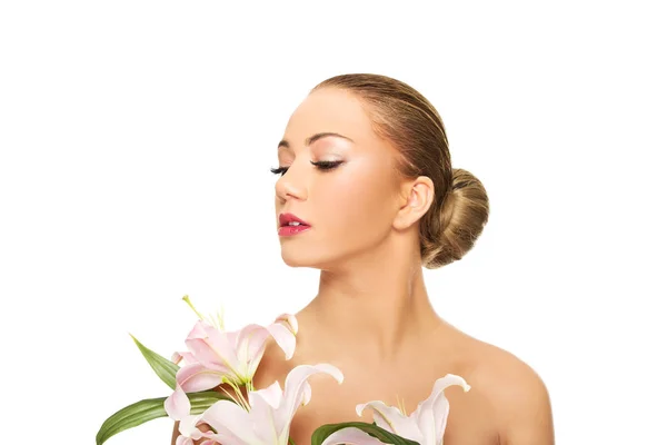 Beautiful spa woman with lily. — Stock Photo, Image