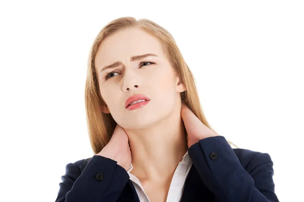 Beautiful caucasian business woman touching her neck. — Stock Photo, Image