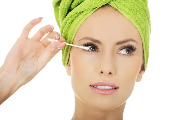 Woman removing make up with cotton bud. — Stock Photo, Image