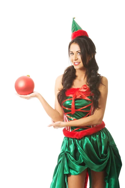 Woman holding christmas bubble on the right hand — Stock Photo, Image