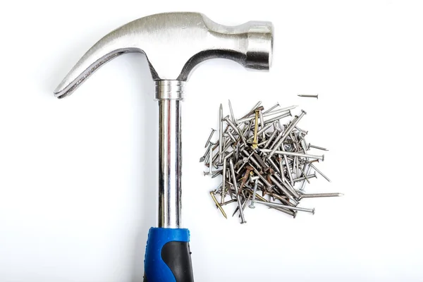 Hammer and metal nails on white background — Stock Photo, Image