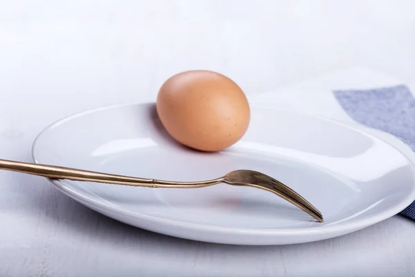Hard-boiled egg on the plate — Stock Photo, Image
