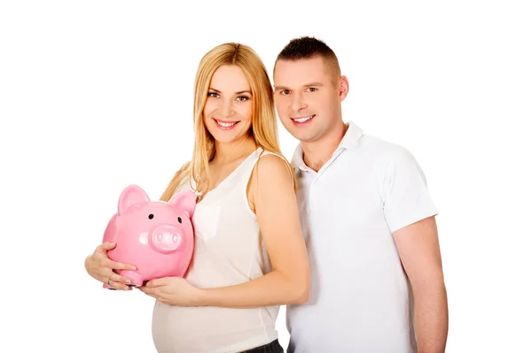 Bonito jovem casal com banco porquinho — Fotografia de Stock