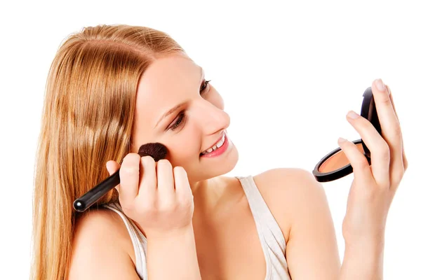 Attractive woman doing make-up on face. Isolated — Stock Photo, Image