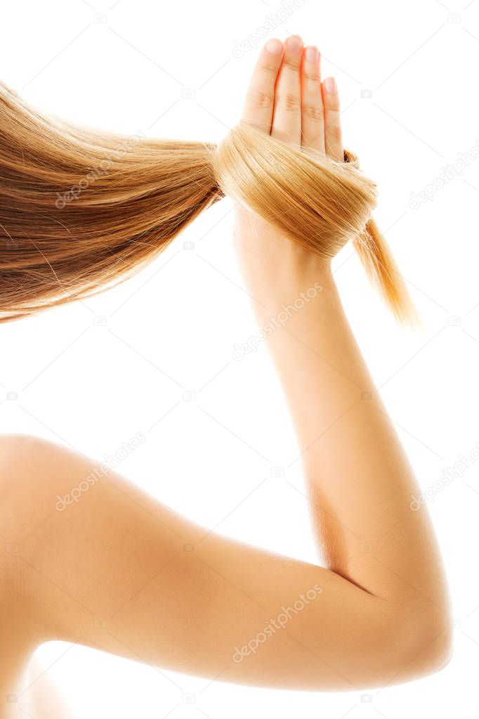 Long blond human hair close-up.