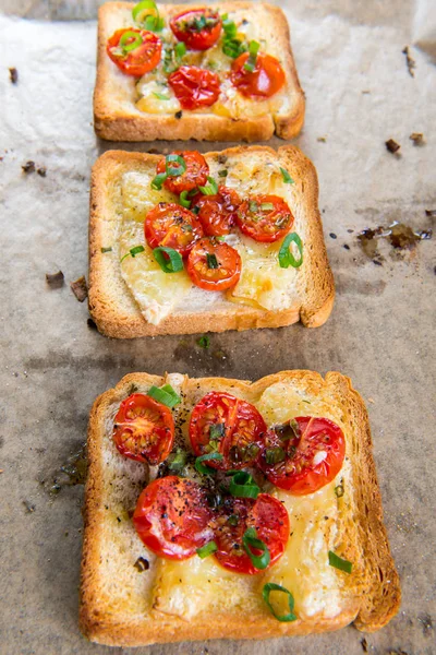 Grilled toast with camembert and cherry tomatoes