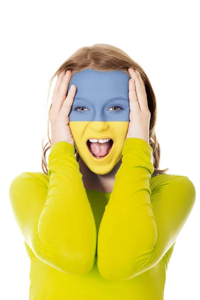 Woman with Ukraine flag on face. — Stock Photo, Image