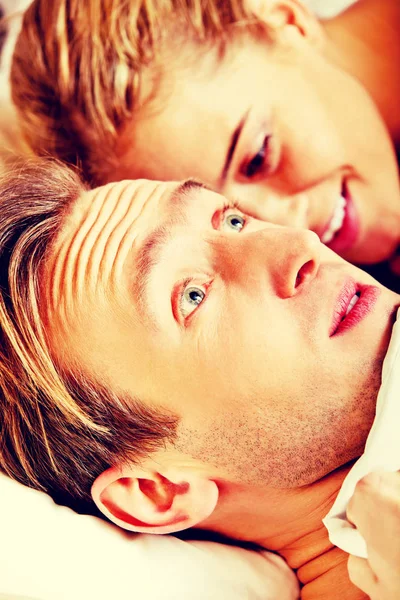 Woman whispering to her husband and he laughting — Stock Photo, Image