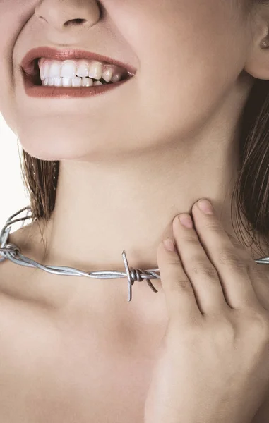 Woman with barbed wire around her throat. Pharyngitis inflammation.