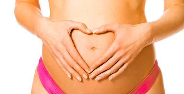 Heart shape on pregnant belly — Stock Photo, Image