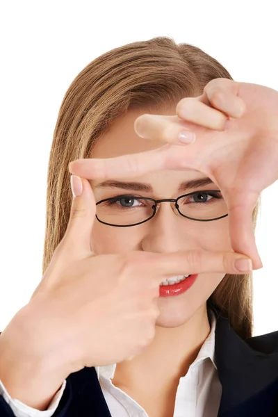 Woman makes frame from hands — Stock Photo, Image