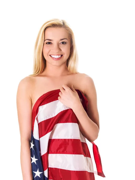 Hermosa mujer rubia envuelta solo en una bandera americana — Foto de Stock