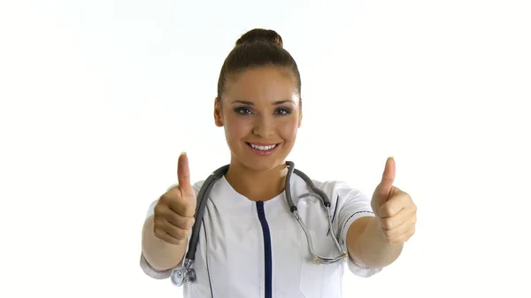Young female doctor or nurse shows thumb up — Stock Photo, Image