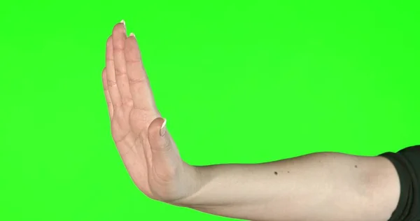 Жести жіночої руки на зеленому екрані: НІ — стокове фото