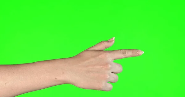 Female hand gestures on green screen: pointing — Stock Photo, Image