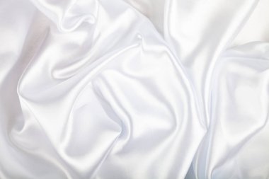 Beyaz ipek kumaş kıvrımları ile. Güzel arka plan.