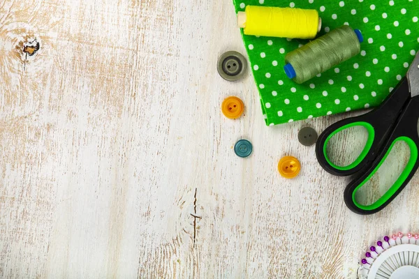 Sewing Accessories Green Fabric Wooden Background Fabrics Measuring Tape Pins — Stock Photo, Image