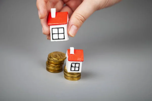 Small Houses Coins Man Takes One House Hand Buying Selling — Stock Photo, Image