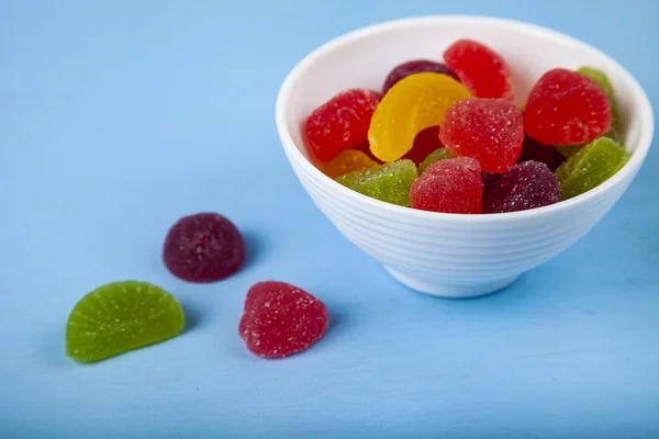 Multicolored marmalade in a white bowl — Stock Photo, Image