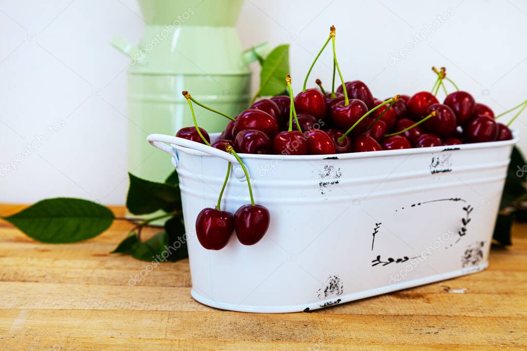 Ripe sweet cherries on a wooden background. Tasty berries. Still life.