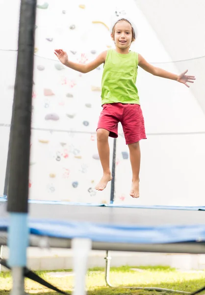 Little Boy Santa Hat Jumping Trampoline — Stock Photo, Image