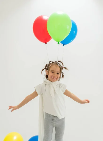 Happy boy with a bunch of balloons — Stock Photo, Image