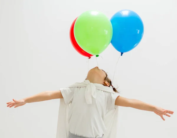 Happy boy with a bunch of balloons — Stock Photo, Image