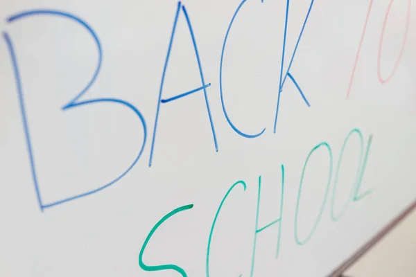 Back to school written on whiteboard in school — Stock Photo, Image