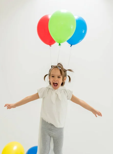 Garçon heureux avec un tas de ballons — Photo