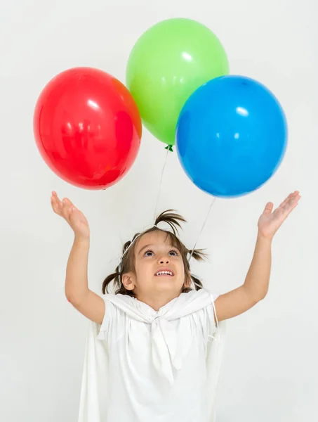 Gelukkige jongen met een bos van ballonnen — Stockfoto