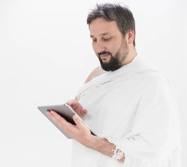 Adult Hajj holding tablet — Stock Photo, Image