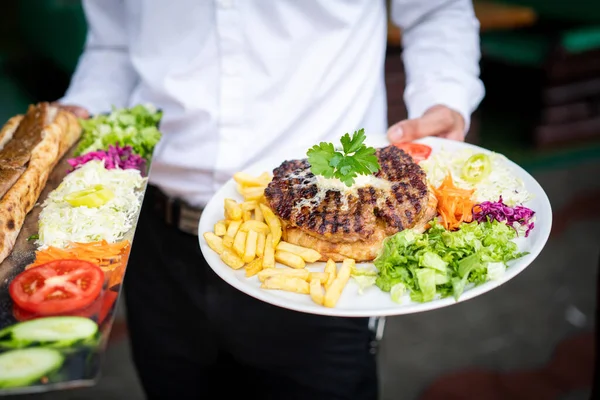 Waiter Holding Two Plates Meat — Stock Photo, Image