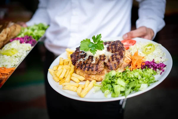 Waiter Holding Two Plates Meat — Stock Photo, Image