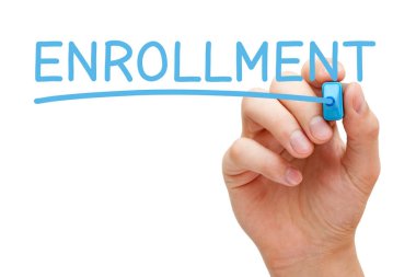 Hand writing the word Enrollment with blue marker on transparent wipe board isolated on white. clipart