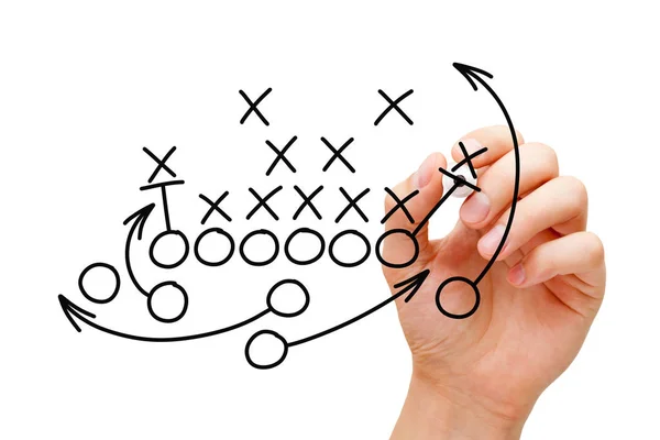 Trainer zeichnet American Football-Spielbuch-Strategie — Stockfoto