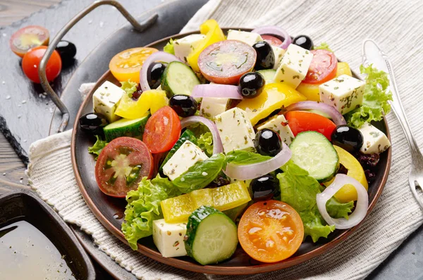 Mediterranean diet dish greek salad on vintage metal tray closeu
