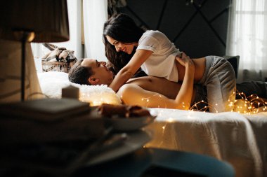 Romantic young  couple in love in bed