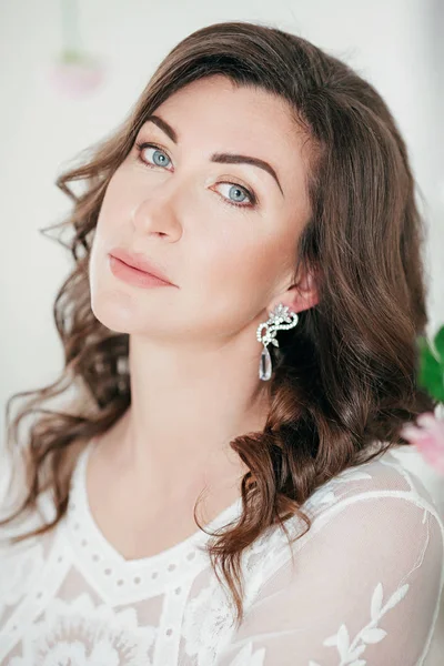 Portrait of beautiful brunette woman with makeup