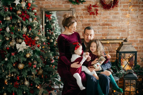 Happy parents Posing in Christmas Interior