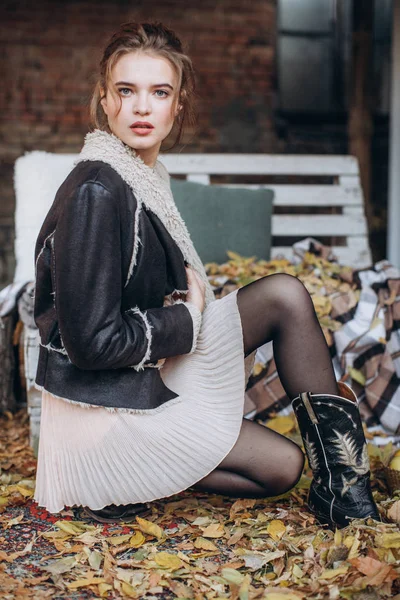 beautiful  Woman in sweater  in  Autumn Garden