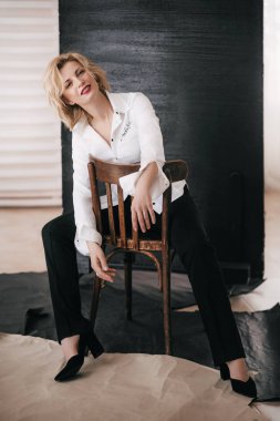 young woman in white shirt in studio
