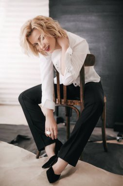 young woman in white shirt in studio